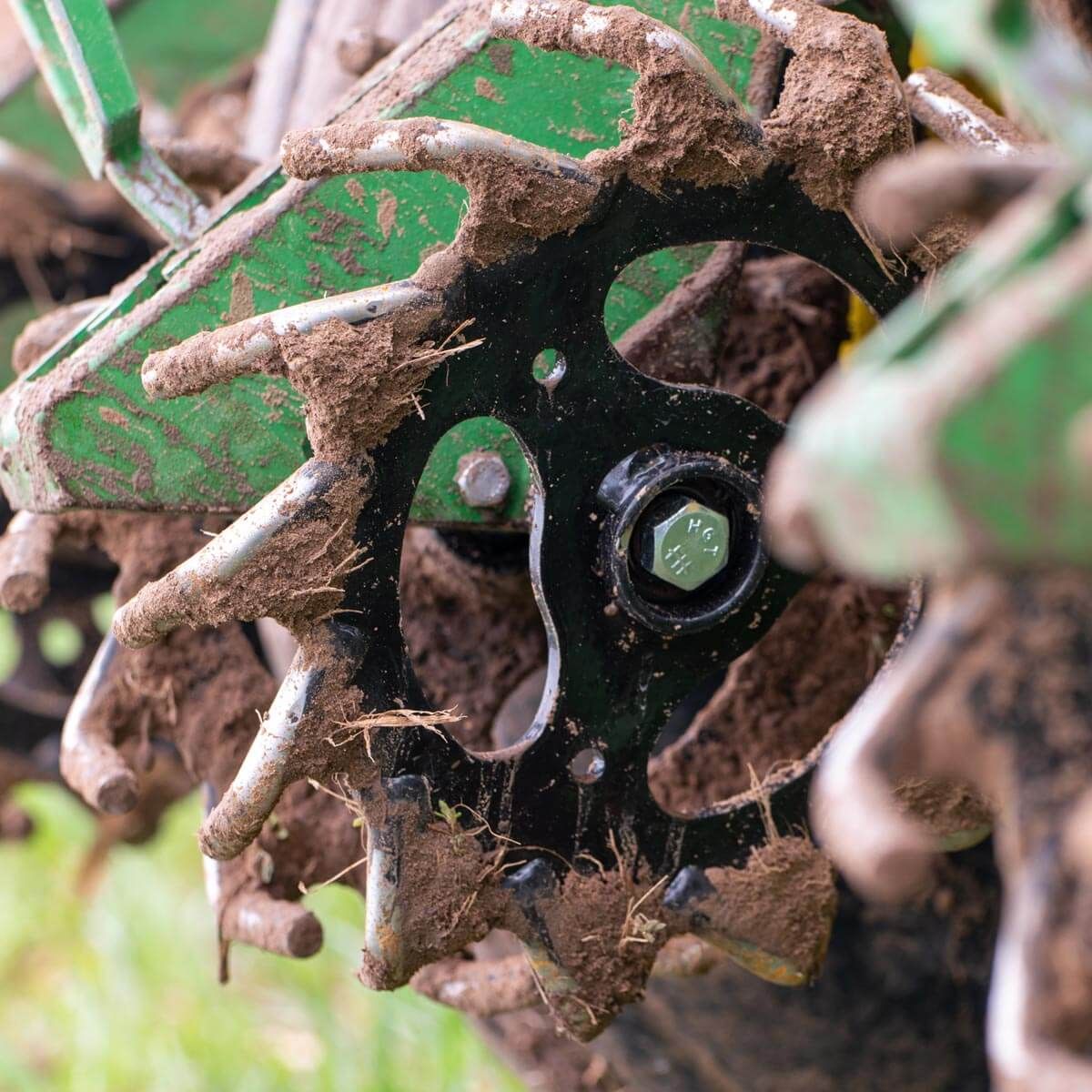 Dirty Schlagel Posi-Close Planter Wheels mounted on John Deere planter